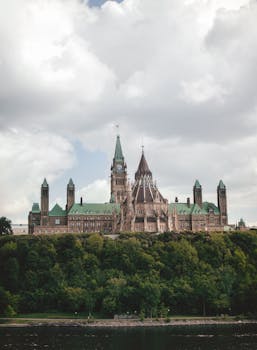 Stunning view of the Gothic Revival Parliament Hill buildings in Ottawa during summer.