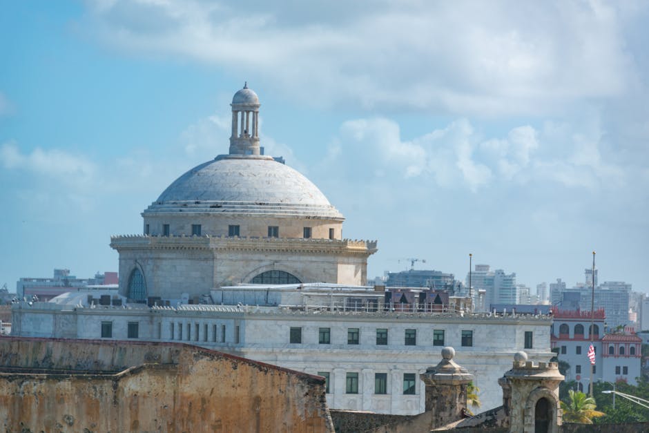 The iconic dome of the Capitol Building in San Juan, Puerto Rico under a clear sky.