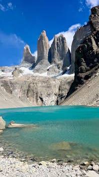 Pristine blue lake with majestic granite towers in Torres del Paine, Chile.