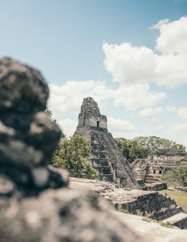 Explore the ancient Mayan ruins of Tikal, a UNESCO World Heritage Site in Guatemala.