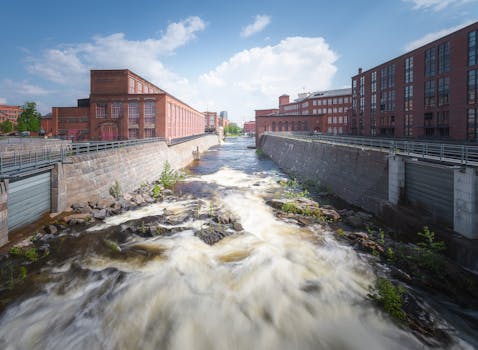 Explore the scenic Tammerkoski rapids with historic brick buildings in Tampere, Finland.