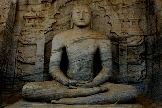A serene ancient Buddha statue carved in stone at Gal Vihara, Sri Lanka, showcasing historic Buddhist art.