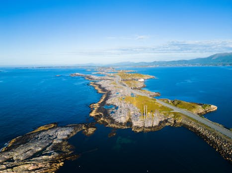 Aerial view of the stunning Atlantic Road in Kristiansund, Norway, surrounded by blue ocean.