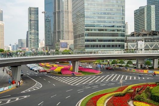 A vibrant urban scene showcasing skyscrapers and a busy road in Shanghai, China, highlighting modern architecture.