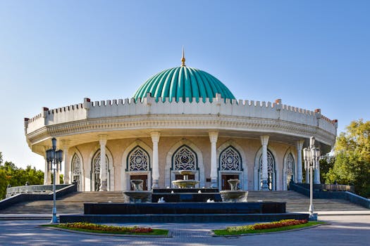 Beautiful exterior of the Amir Timur Museum featuring a striking turquoise dome in Tashkent, Uzbekistan.