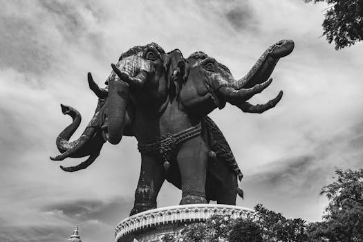 Black and white photo of the Erawan Elephant statue in Bangkok, capturing its intricate design and majestic presence.