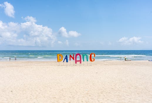 Bright and sunny day at Da Nang beach in Vietnam with clear skies and a calm sea.